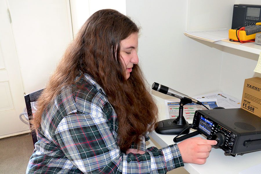 Sophomore, Ellie Meyes switches band on her radio to access a different frequency. Meyes amateur radio call sign is KE0FNN.  