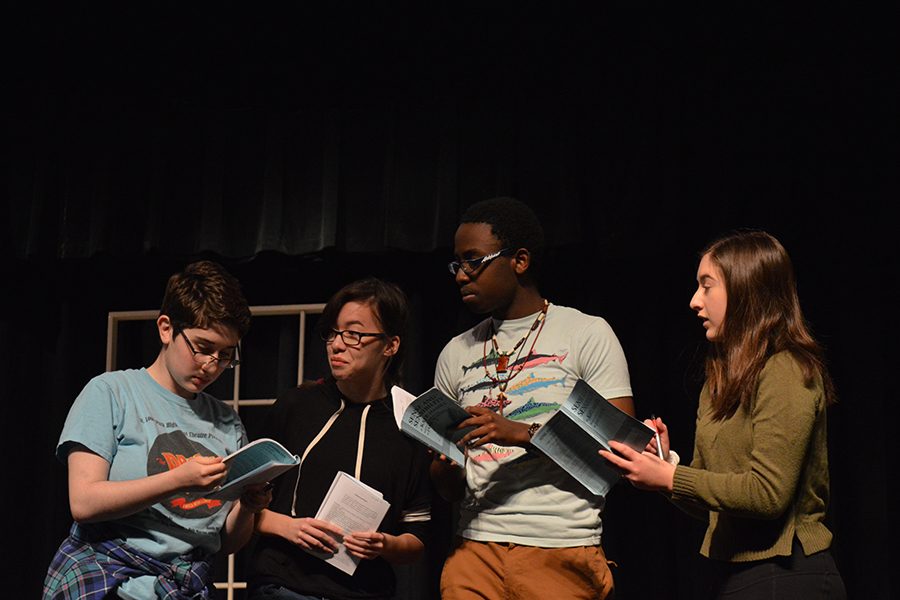 Spring play cast members Elise Bargman, Zoey Zachek, Ndunzi Kunsunga, and Ruby Stillman rehearse their roles in Sense and Sensibility on April 19. Sense and Sensibility has challenged theater students as they must speak with British accents throughout the play. 