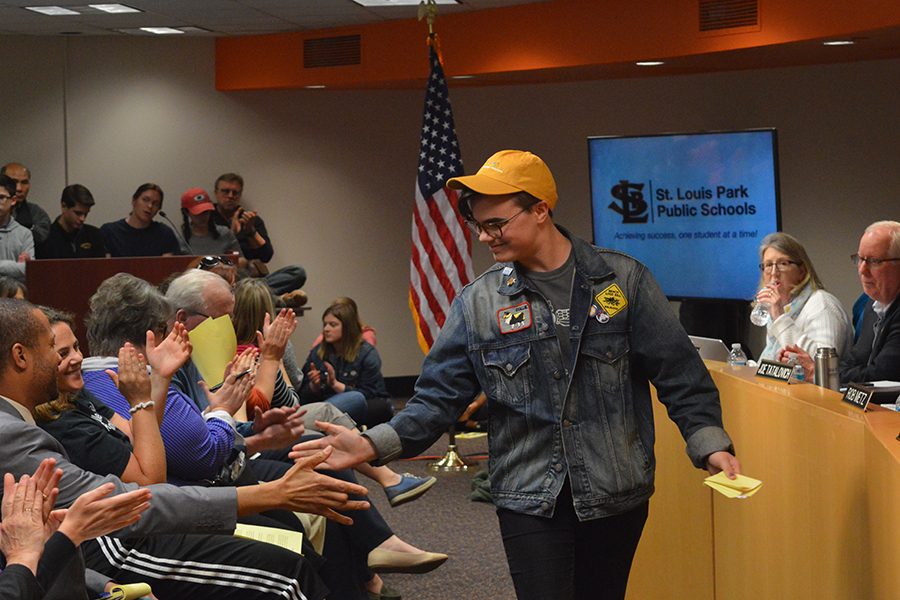 Freshman Mathew Loftus receives high fives after his speech at the school board meeting April 24. The Gender Sexuality Alliance and their supporters proposed a gender inclusive policy to the school board.