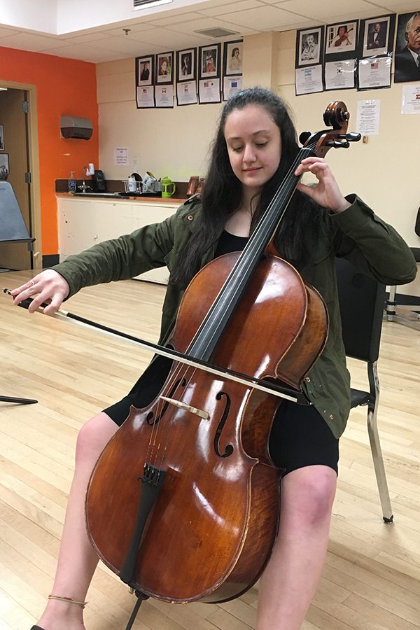 Freshman Hannah Greenstein practices one of orchestras pieces on April 19.