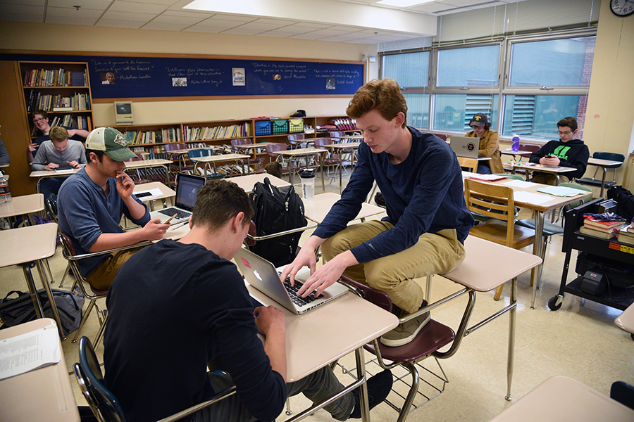 Juniors Ben Provost, Charlie Schuebel and David Salamzadeh work on computers in their study hall class. Provost has a 504 plan for his ADHD. 