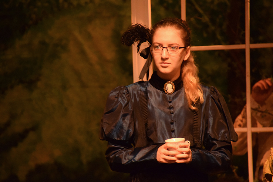 Junior Maddy Kapel practices at a theater dress rehearsal after school. The performances were held in the high school auditorium. 