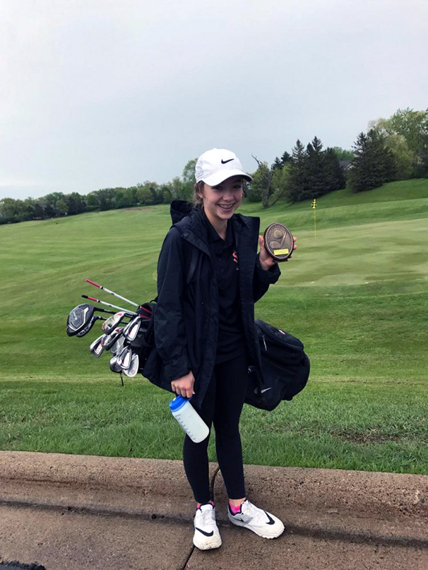 Eighth grader Maia Seidel wins award for hitting the ball closest to the pin on hole eight at the tournament style match May 10. The girls finished with a score of 225. 