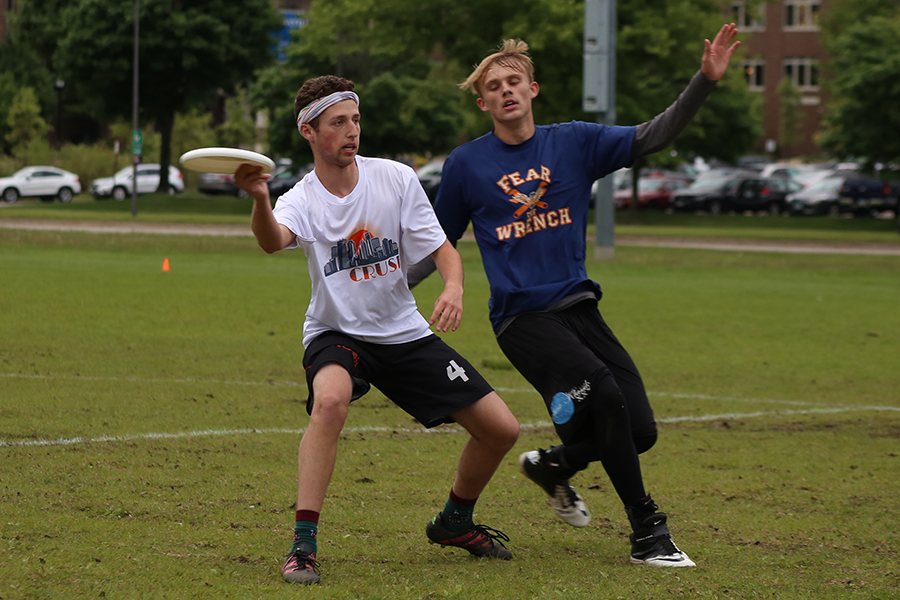 Senior Raphy Gendler throws the disk during the Boys Ultimate teams last game vs Cooper.