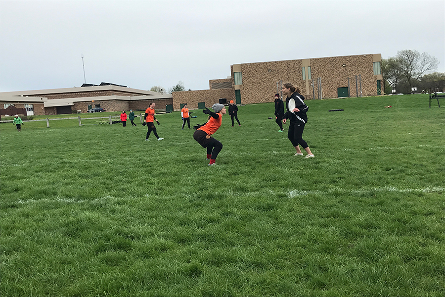 Senior Ruthie Hope prepares to throw the disc during the game against South Squall. The girls team went 1-5 in the Madison Mudbath Tournament April 29-30 in Madison, Wisconsin. 
