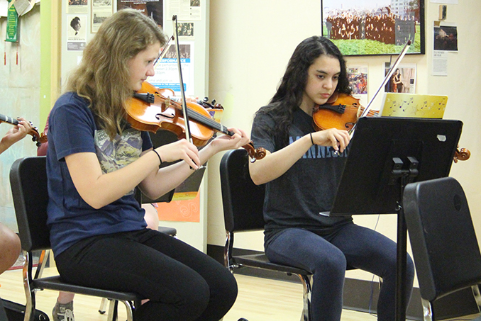 Sophmores Hayley Westwood and Claire Middleton practice for their spring concert on May 23.