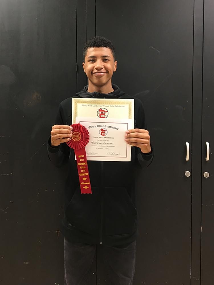 Senior Trez Cook-Hinton with his award of achievement for his photo Grounded. This is the second time a Park student has won an award of achievement. 