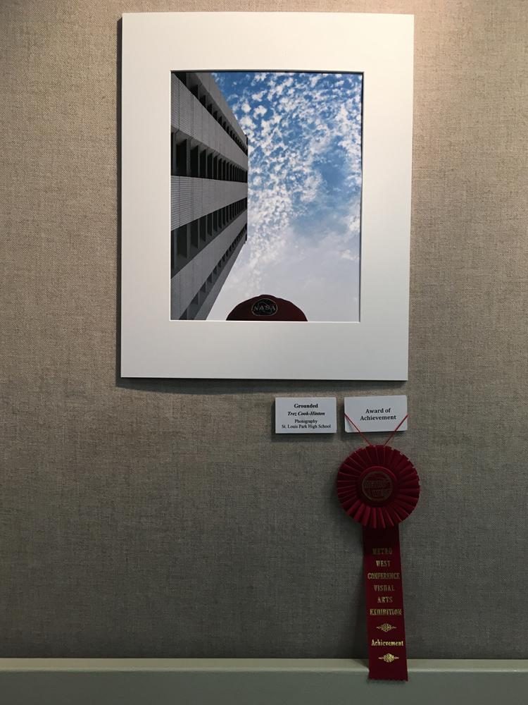 Senior Trez Cook-Hintons photo Grounded on display at the Metro West Conference Visual Arts Exhibition. The photo won an award of achievement. 