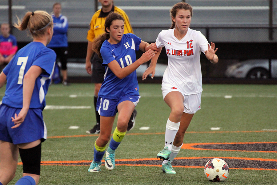 Junior Anika Hanson finagles her way past a Hopkins player on August 24.