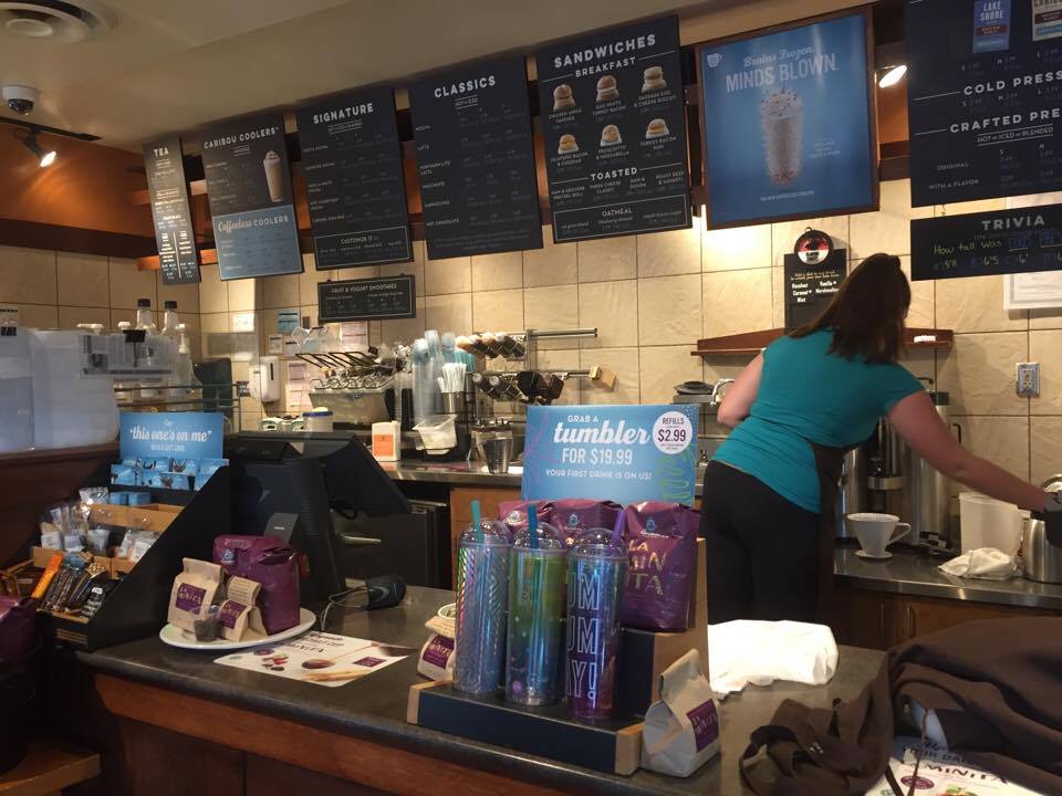 Barista brews tea for customer at Caribou coffee located on Minnetonka boulevard. The coffee shop offers lots of open study space for students. 