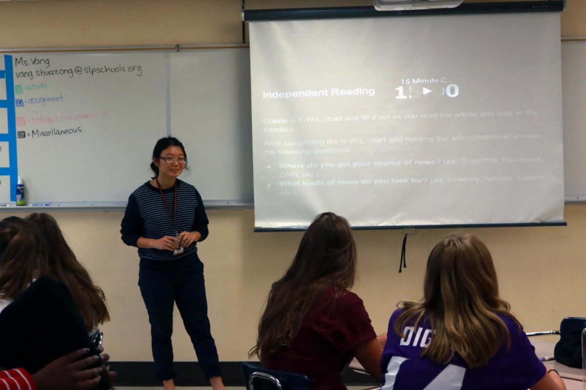 Parks new teacher Shuazong Vang teaches in front of Honors English 9, Sept. 28. 
