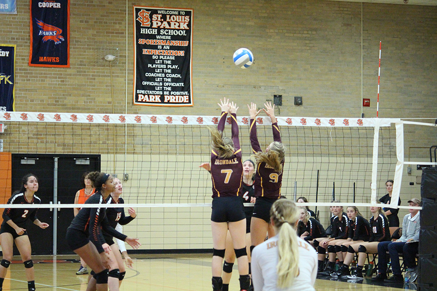 Senior captain Kim Lindgren hits over the block with support from her teammates. Park won in the fourth set of the match.  