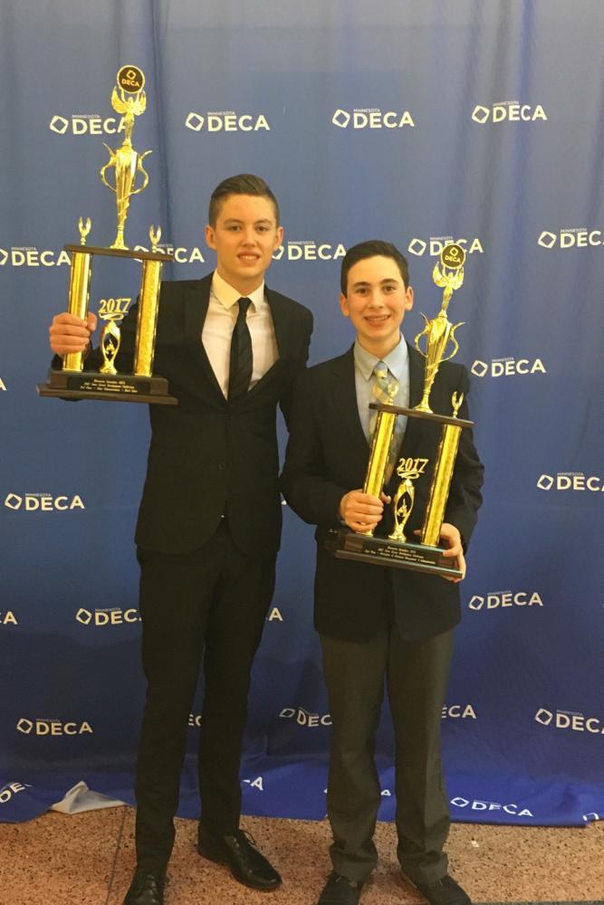 Photo used with written permission from Yonah Davis.

DECA president Yonah Davis and officer Lewis Brown pose with trophies received at the State competition March 19-21. 