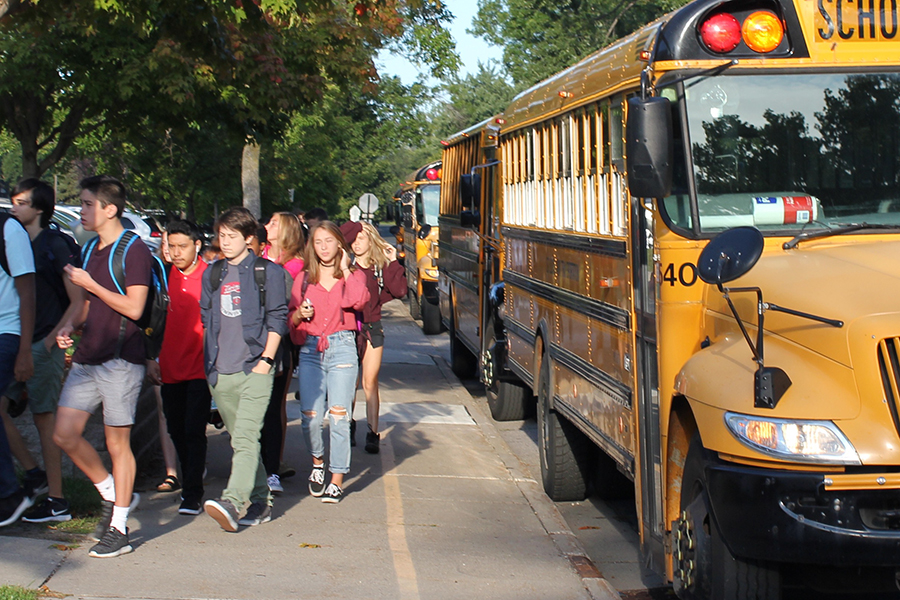 Students arrive off the buses for the first day of school on September 5.