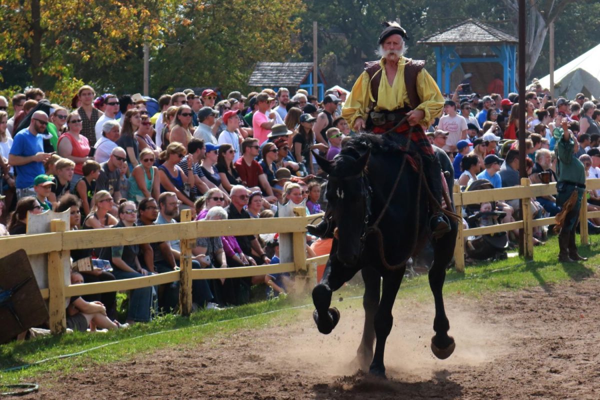 A knight marshal gallops across the jousting arena at the Renaissance
Festival.