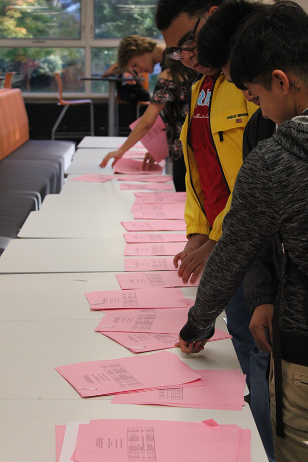 Students pick up their schedules in the cafeteria on the first day of school, September 5.