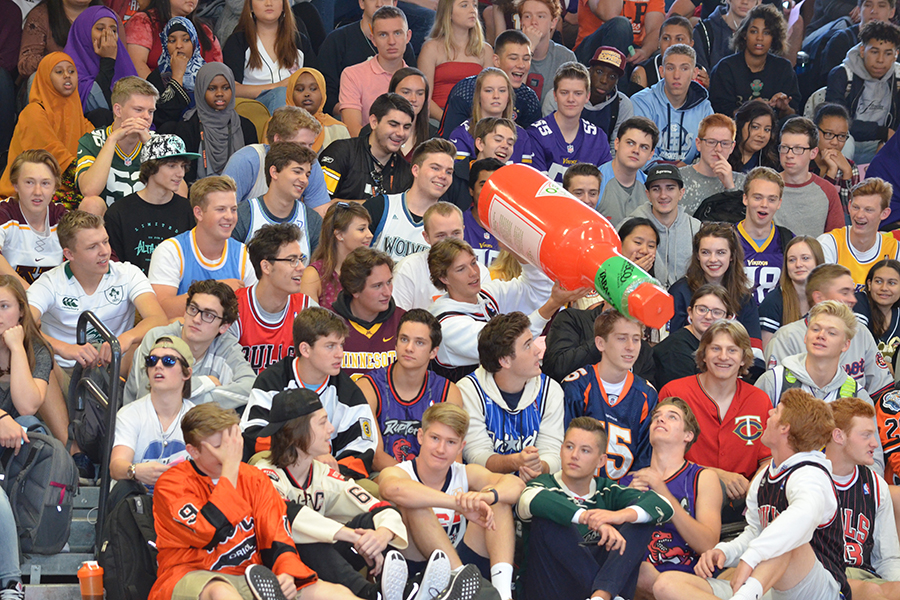 Senior students throw around an inflatable Tobasco bottle during the mornings pep fest.