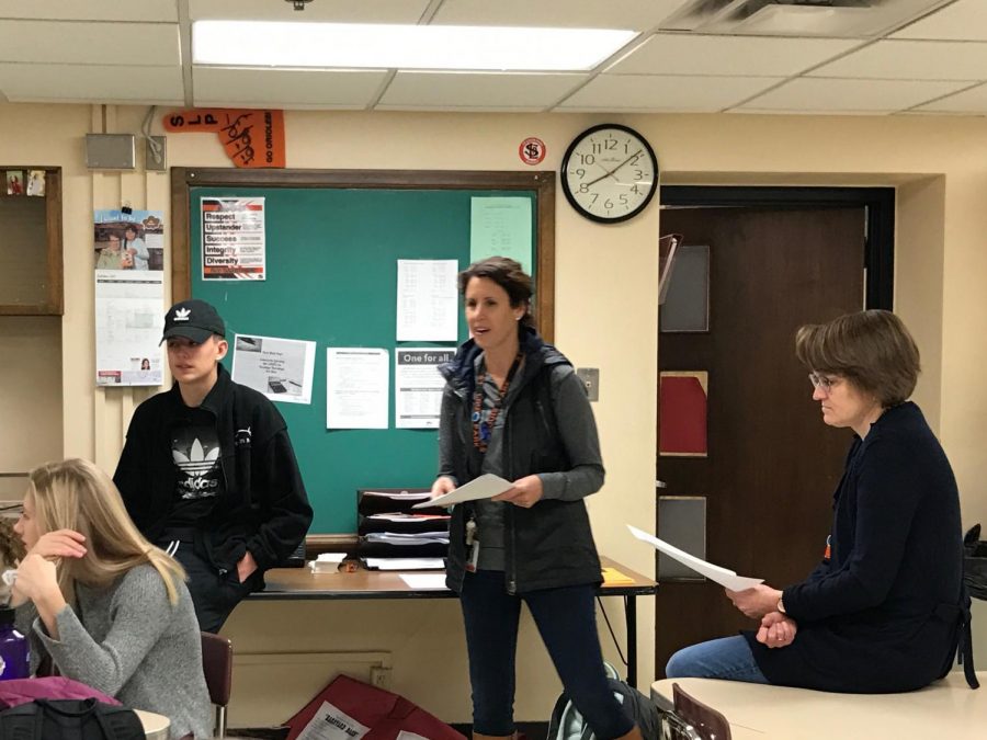 DECA co-advisers Sally Adams and Sophia Ross and senior officer Lewis Brown address DECA members attending the Fall Leadership Conference Oct. 27. The conference allows DECA chapters to bond within their chapters and with other Minnesota chapters.