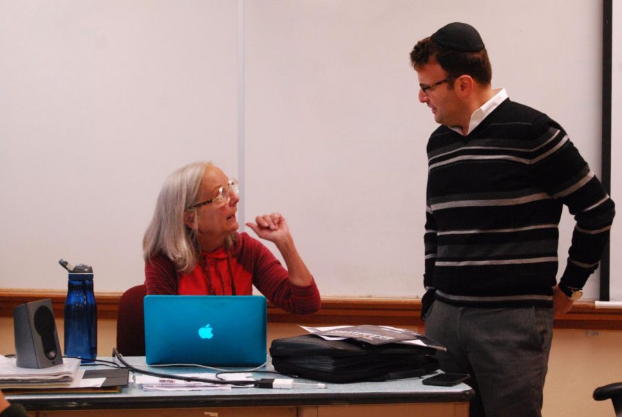 JSU adviser Mary Norris and Rabbi Tzvi Kupfer talk before the start of the meeting Nov. 26. The Jewish-Student Union is open to anyone and meets in A316 on Thursdays after school.