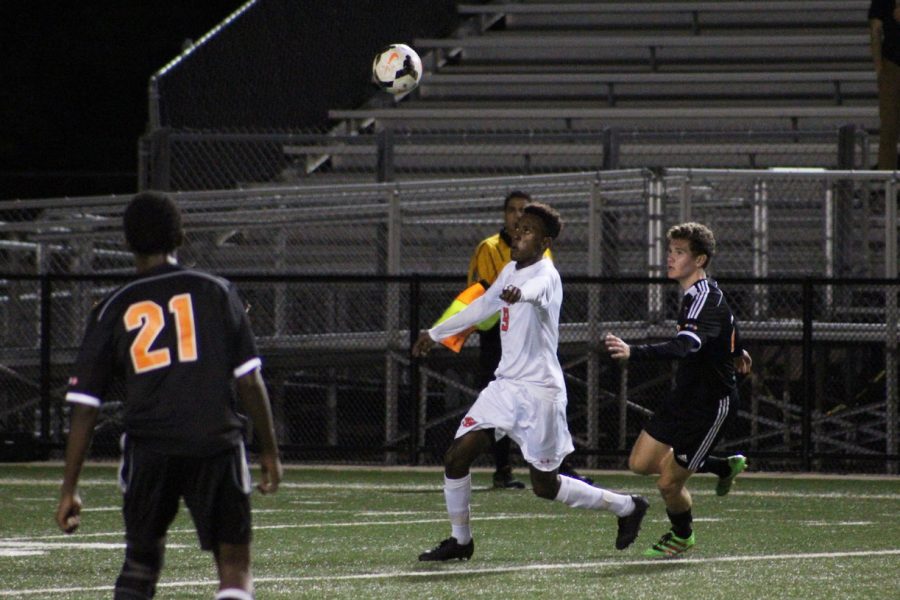 Senior Abati Dedefo winds up to kick the ball in the Orioles match against Minneapolis South. Dedefo participates in both soccer and cross country at the varsity level.