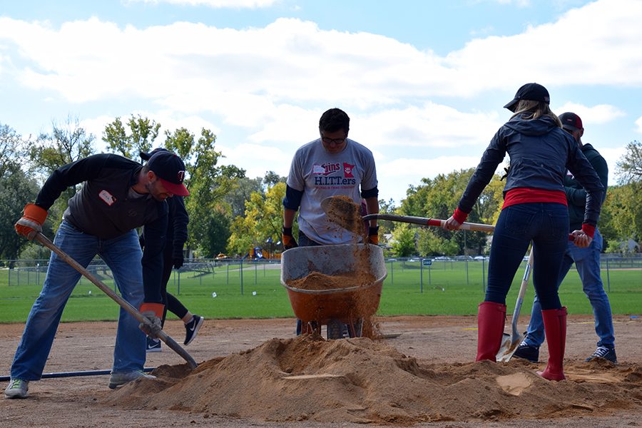 TORO volunteers shovel dirt off of the pitching mound at Dakota Field, Oct. 4. 