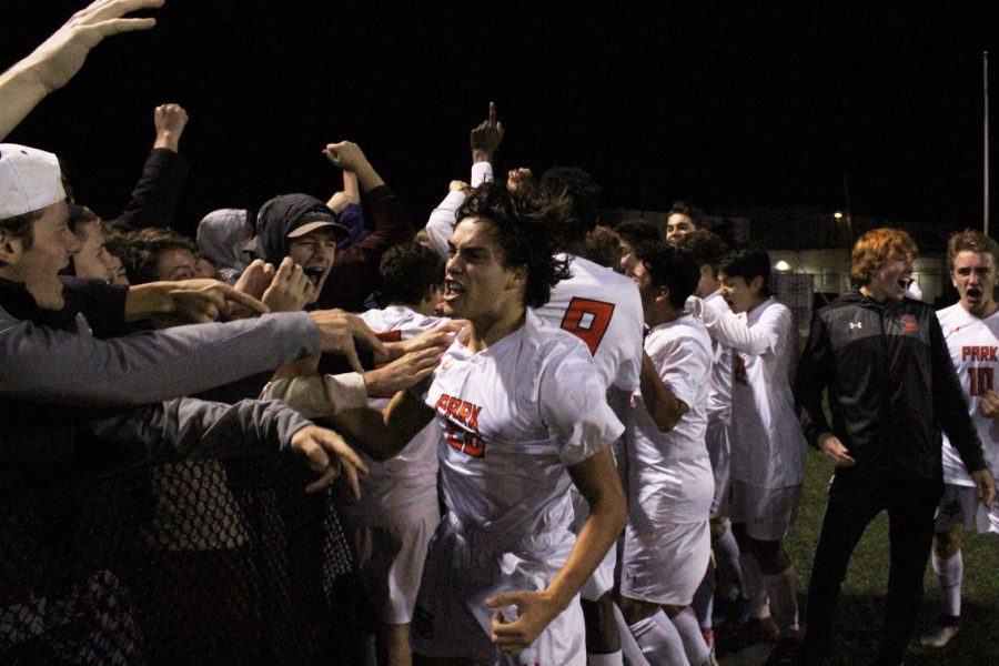 Junior varsity team member Thomas Salamzadeh celebrates with spectators after scoring the winning goal. Park won 4-2 in penalty shoot out. 