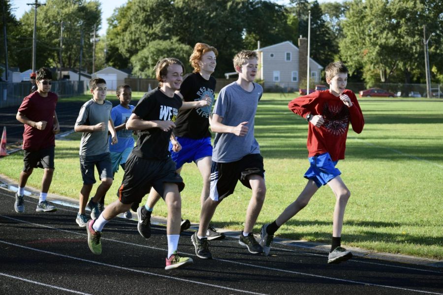 Cross country does an easy run around the track to conserve energy for their upcoming Sections meet. Photo used with permission by Jill Kraemer.