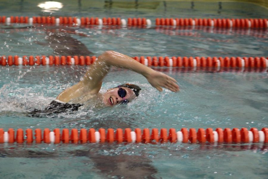 Junior Lexi Lee swims in the 200 freestyle individual event. The team won against Bloomington Jefferson 51.5-42.5