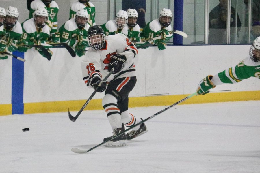 Senior Forward Brent Ryan wheels a shot against Edina in Parks first game of the season. They play against Osseo at 7 p.m. on Dec, 5 at the Dick Vraa Ice Arena in Maple Grove.