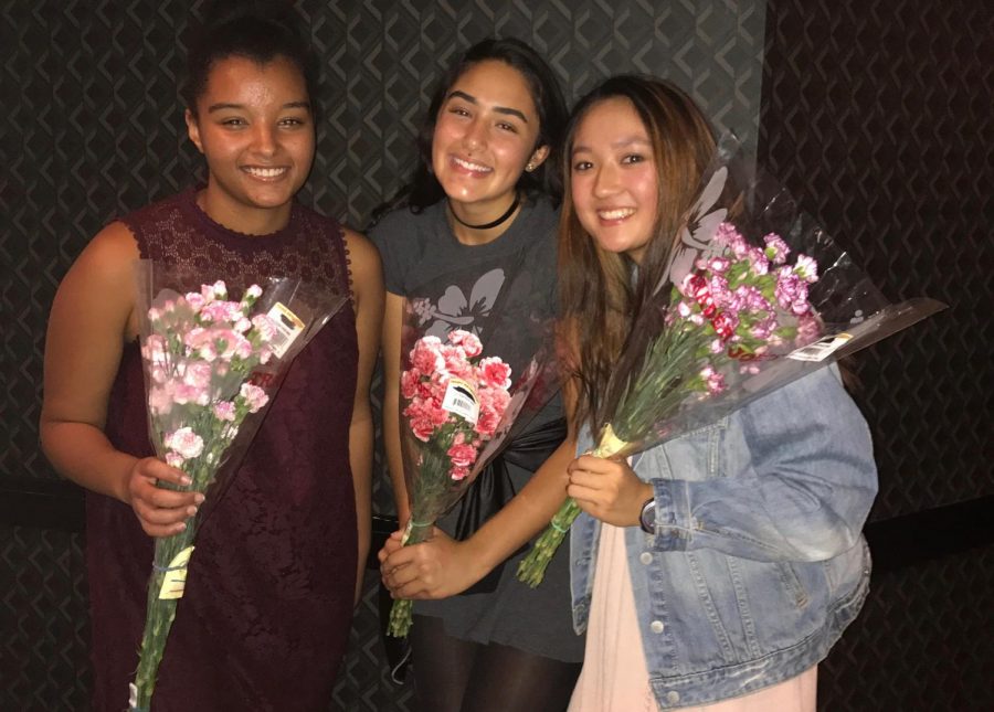 Junior Sidney Hosfield, sophomore Racquel Fhima and Junior Susi Hu at the tennis banquet Oct. 25. The three players received flowers after they were notified that they were chosen as captains for the 2018 season. 