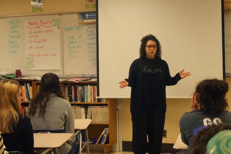 Senior Olivia Massie presents about intersectionality at the feminism club meeting Nov. 21. After her presentation, members further discussed the topic and how to give input in the community. 