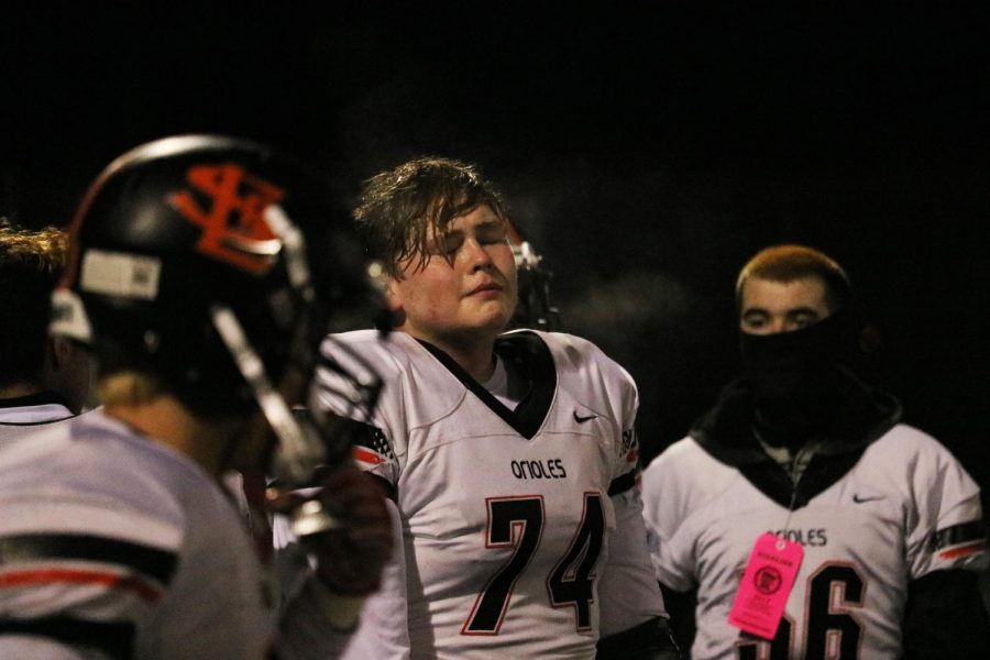 Senior Tony Christanson and other park players become emotional in the final minutes of Parks 24-7 loss against Brainerd in the State quarterfinals. Park scored their only points in the first half of the game. 