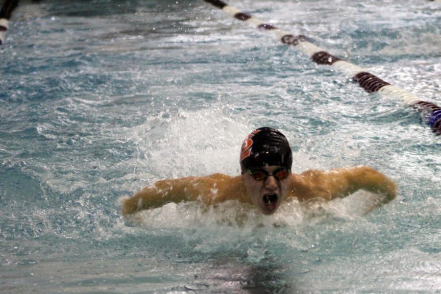 Sophomore William Schwietering takes a breath during his butterfly relay race. The teams meet took place at 7 p.m. Dec. 7 at Richfield Middle School.