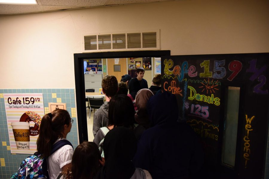 Students rush to Cafe 159 1/2 to get their morning dose of coffee and donuts Dec. 12.