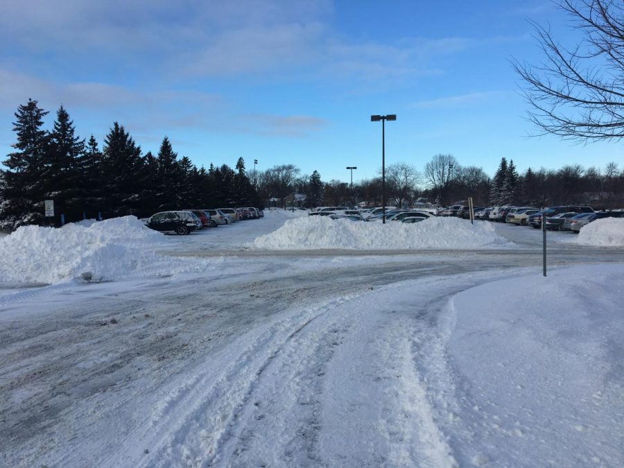 Students cars were buried under snow and had difficulty leaving the parking lot after school on January 22nd.