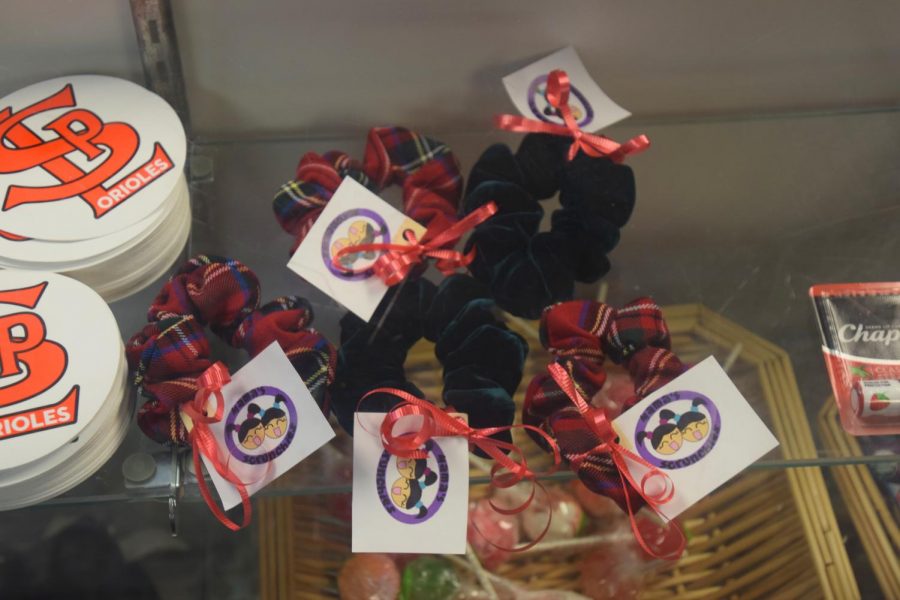Mamas Scrunchies sit in the display case inside the Storiole. They are sold for $3 each.