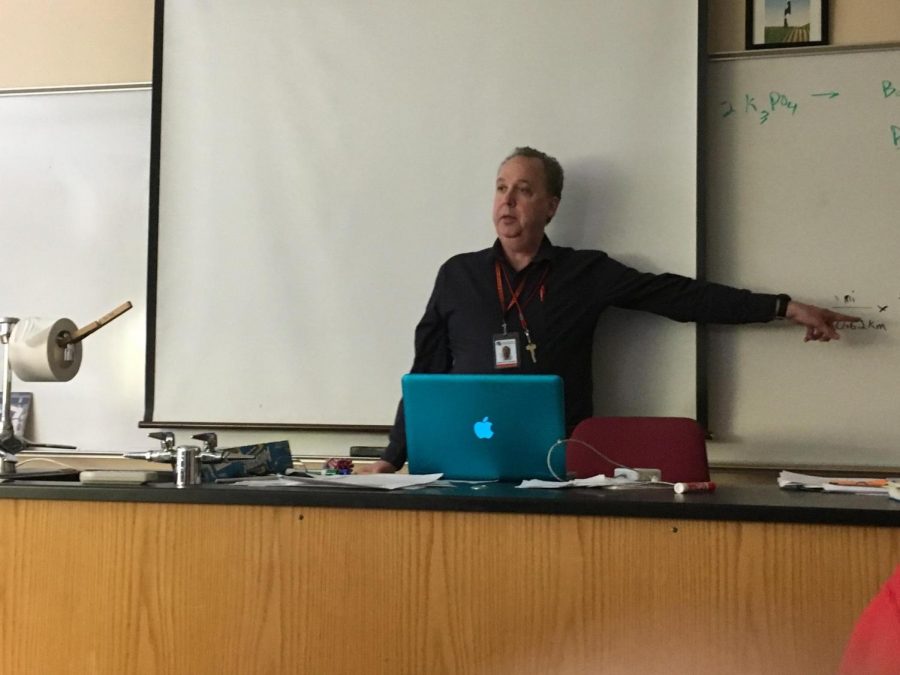 Chemistry teacher Patrick Puskala uses his Macbook Pro to teach class Feb. 2.  