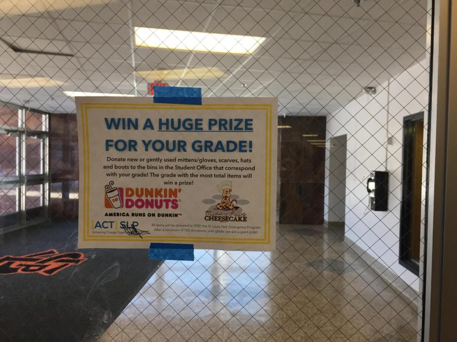 Posters hung around the school advertise the ACT winter coat drive. In an announcement on Feb. 12, the freshman class was revealed to be the winners of the drive competition.