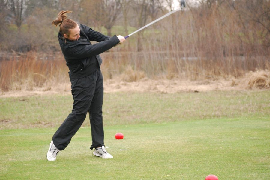 Senior Carly Livingston hits the golf ball at a golf match at Theodore Worth Park. The 2018 season will begin at the end of March.