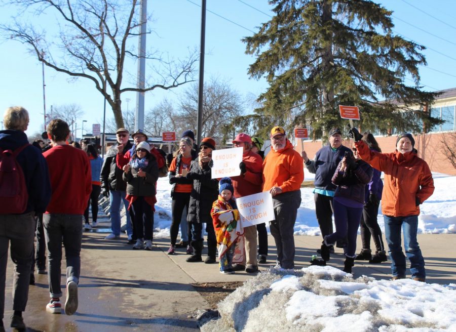 Community members of Park gather outside the school to show support for the walkout, March 14. Buses were provided to students returning from the walkout who had a student ID present.
