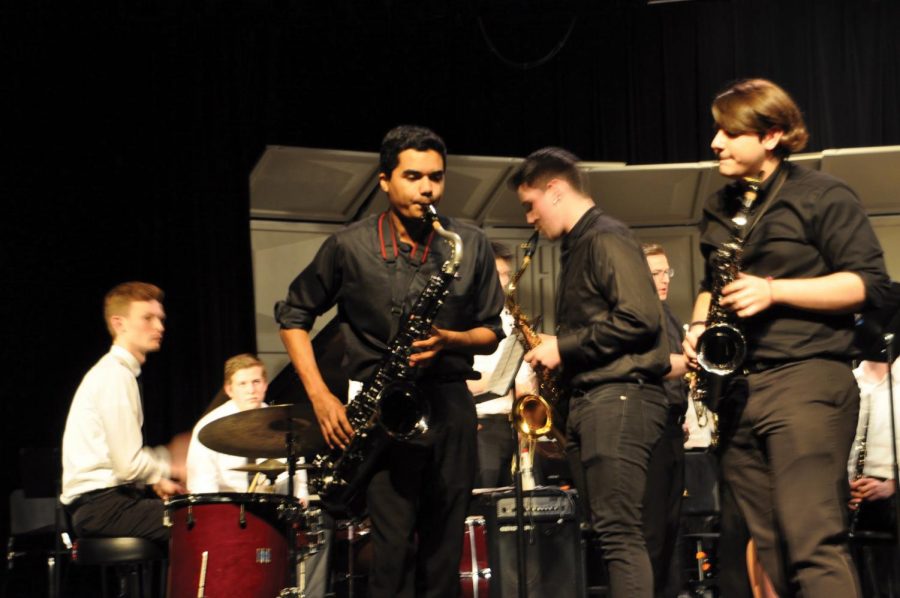 Senior jazz band member Braeden Tousson plays the saxophone during the Pops Concert March 6. Students performed small group interludes between large group songs. 