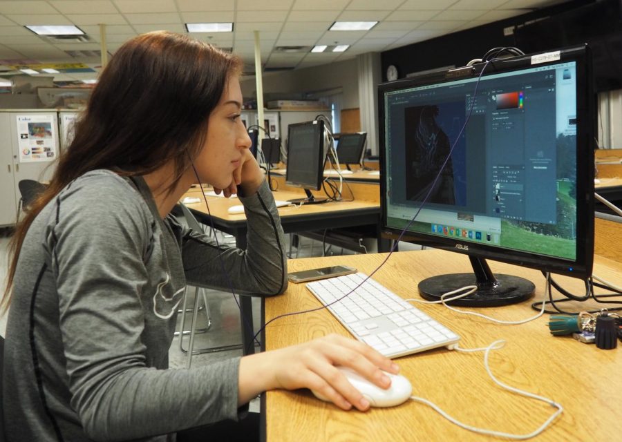 Senior Alex Monson works on her graphics. Monson is currently seeking career opportunities in graphic design.