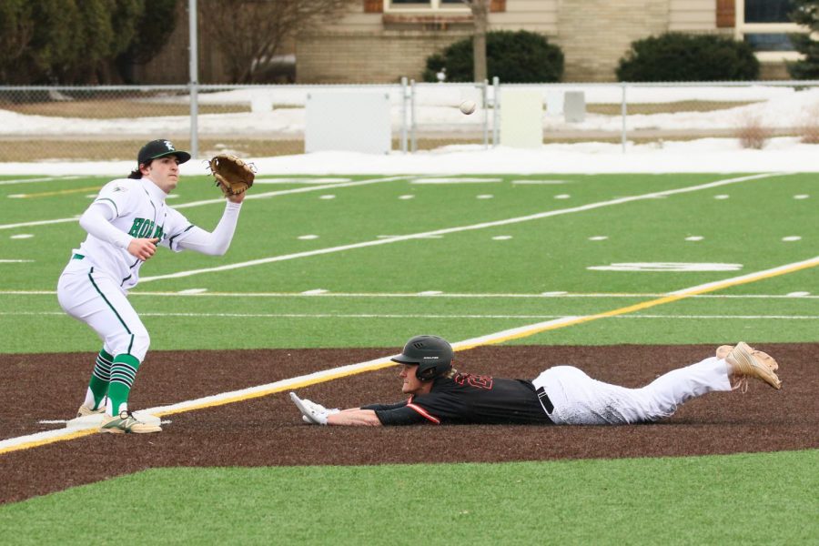 Senior captain Riley Dvorak slides into second base during Parks first regular season game against Edina. Park scored the first run of the game, but lost 3-1. 