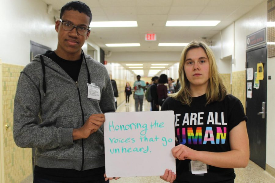 GSA president sophomore Dayna Krause and sophomore Ben Brian stand holding a white board, their only means of communication April 28. They were two of many participants from Park. 