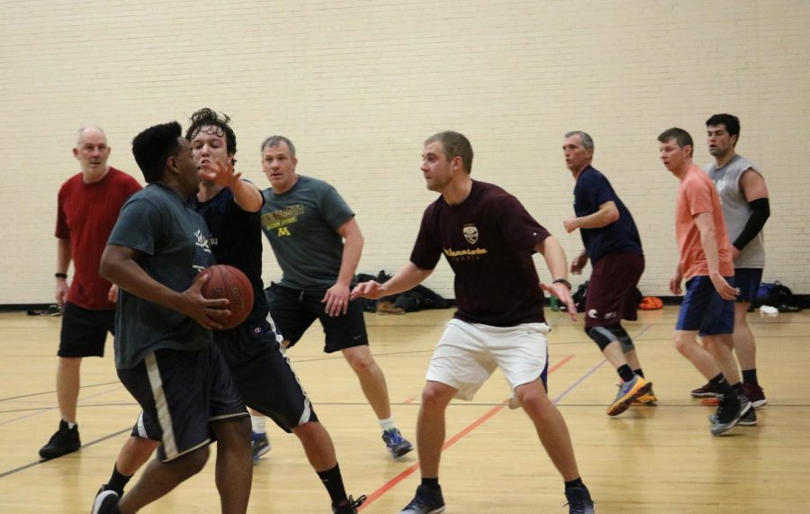 St. Louis Park school district teachers playing a full game of basketball April 11. The teachers get together every week at 6 a.m. on Wednesdays to play at the middle school. 