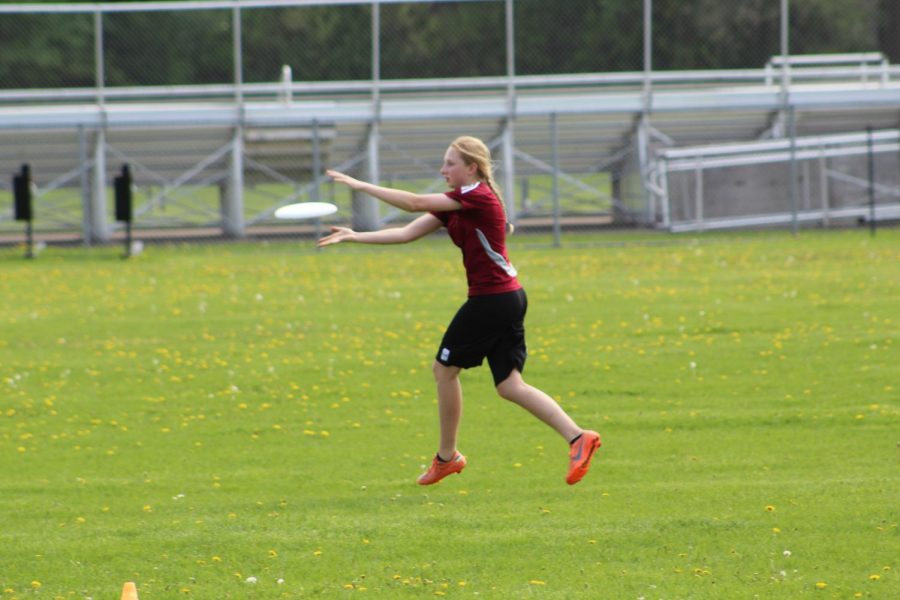 Freshman Amara Foner runs and catches a pass during practice May 21. The team practiced various drills to prepare for their game against Apple Valley May 22.