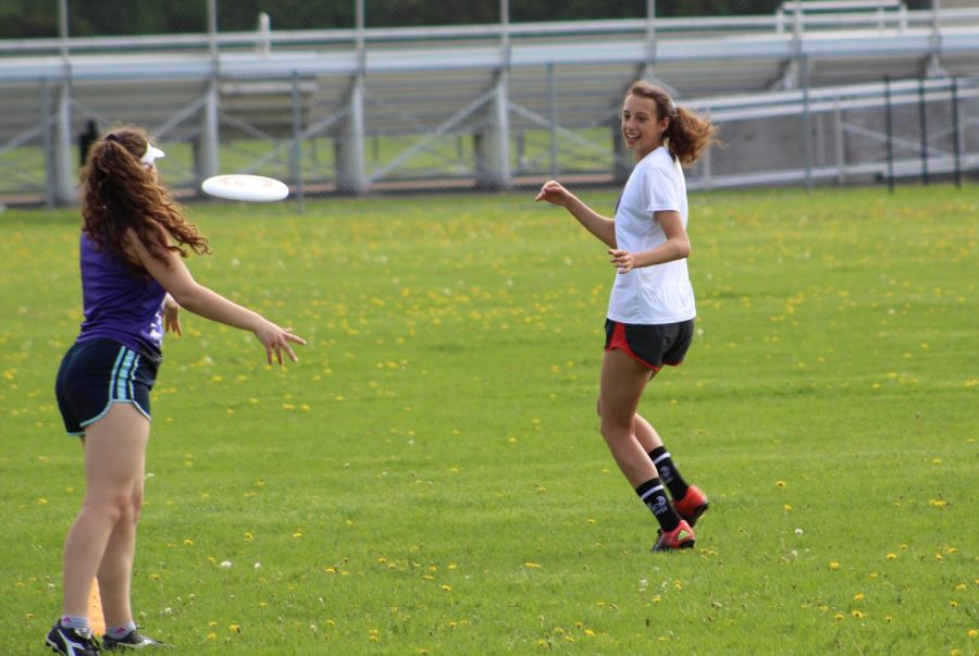 Senior Esther Gendler runs to catch a pass during the girls ultimate teams practice May 21.