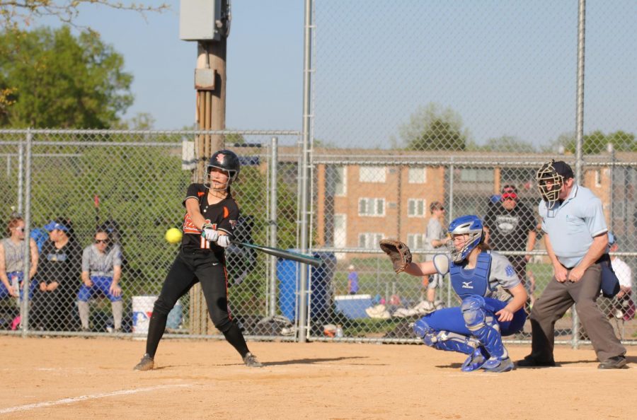 Freshman Marissa Boettcher swings during the Benilde game May 16. Softball sectionals will begin on Monday, May 21 at a location and time to be determined.