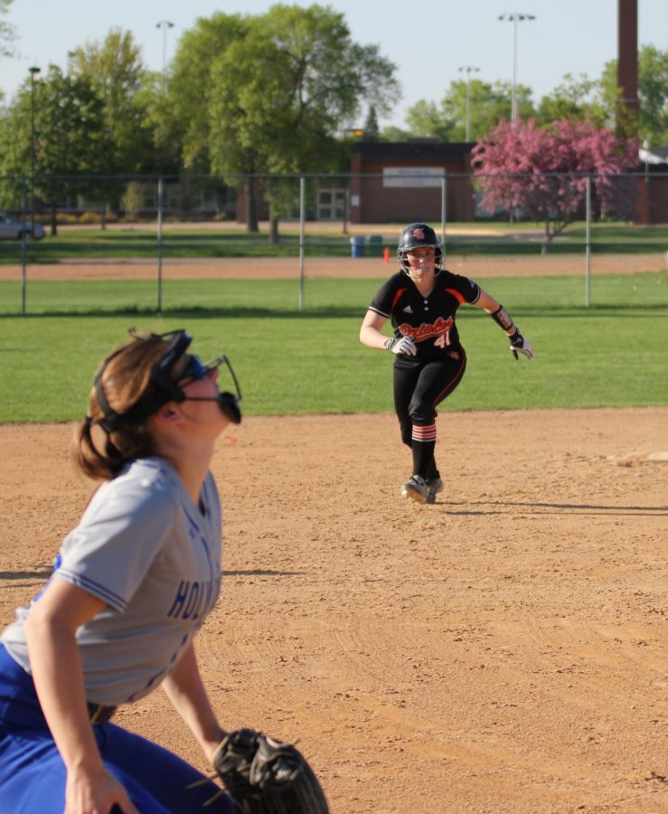 Senior Annabelle Schutte runs to third base during the game against Benilde-St. Margarets May 16.  After the game the team had a banquet to commemorate the seniors. 