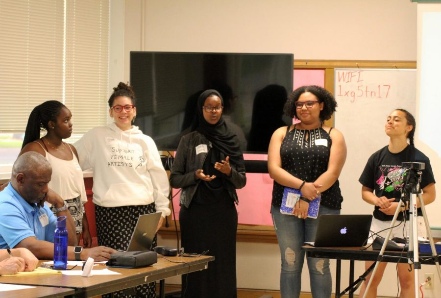 Seniors Doreen Moranga, Olivia Massie, Ubah Abdullahi, sophomore Amaya Fokuo, and senior Anna DuSaire present about the Civil Rights Research Experience to attendees of the Community Building Conversation at the Lenox Community Center on May 17.